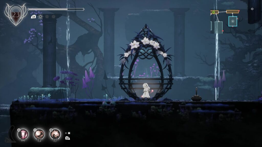 花に囲まれた休息地の中央で、リリィが黒い揺りかごのような祭壇の中に立つ『ENDER LILIES』のゲーム画面